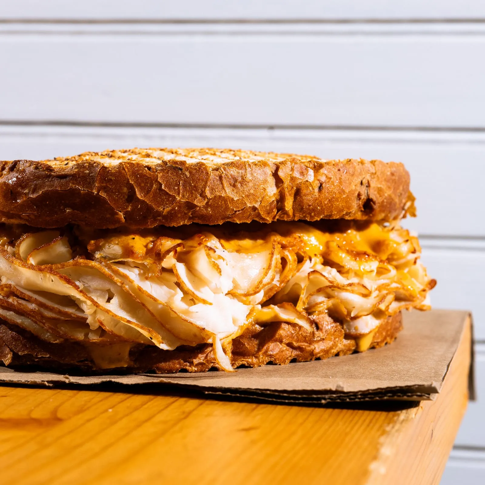 A close crop of a chicken salad sandwich on toast