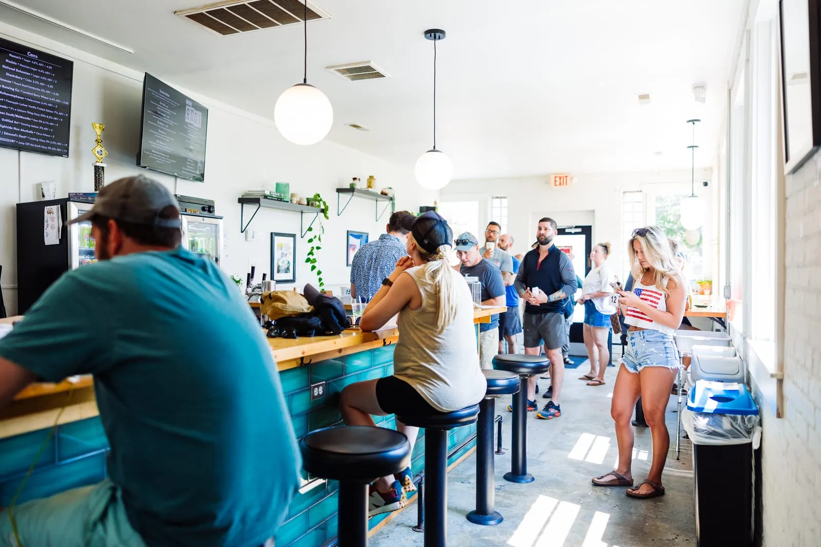 Customers at the green-tiled counter downtown