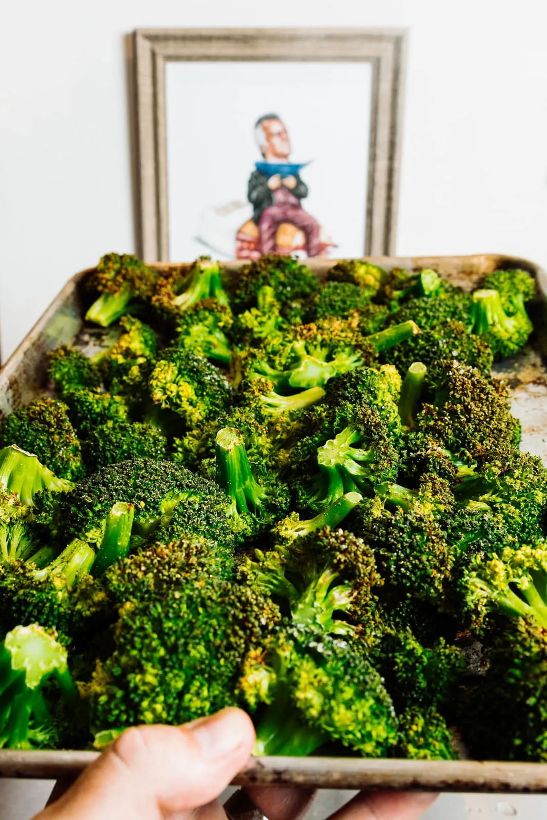 A tray of roasted broccoli out of the oven