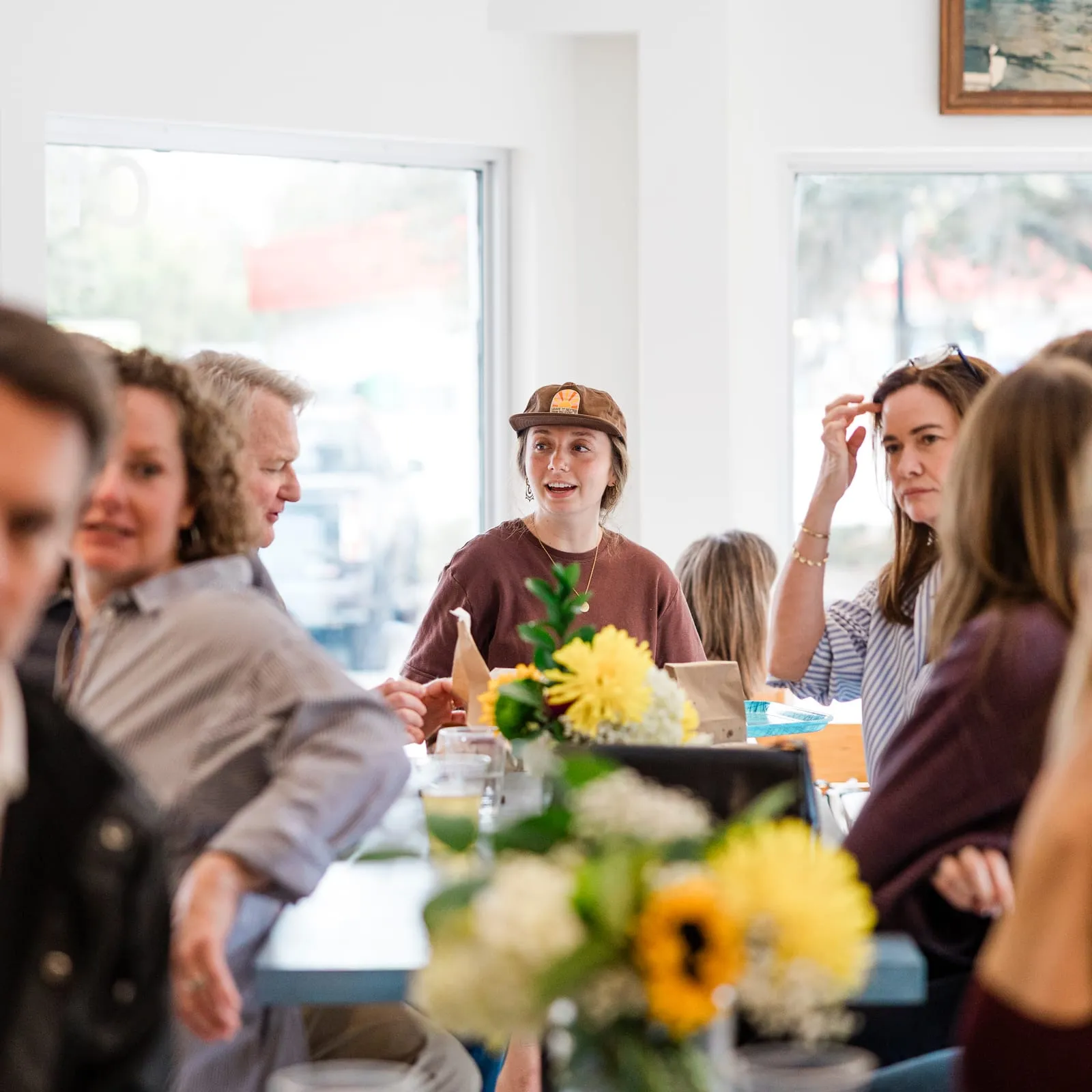 Customers at the communal table on Wrightsville Ave
