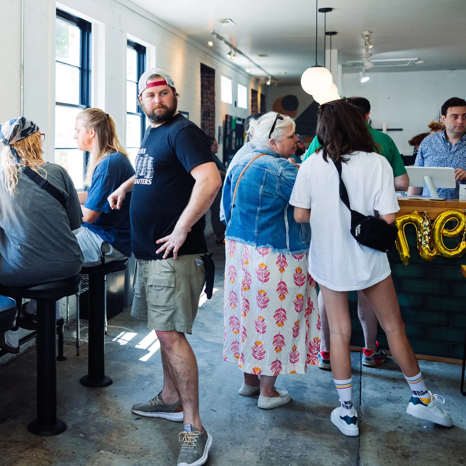 Customers waiting in line inside